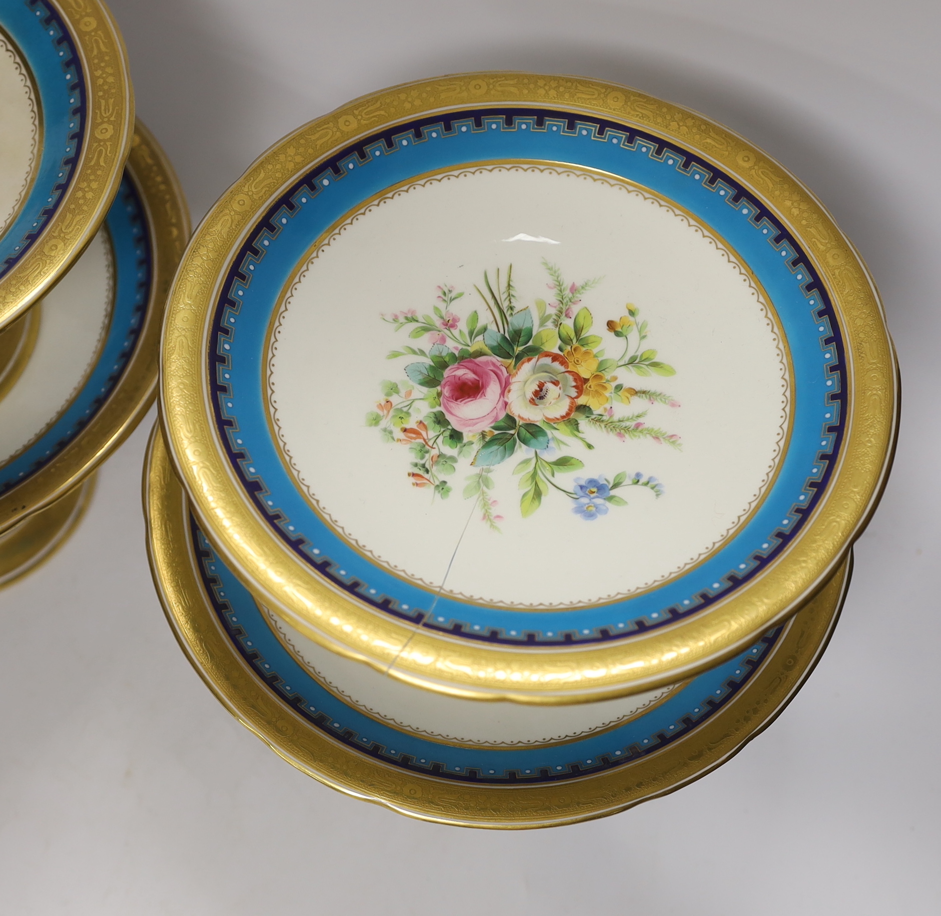 A 19th century Minton porcelain dessert service with gilt and floral decoration, twelve plates and two pairs of various height comports, tallest 16.5cm high